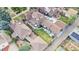Expansive backyard features a lush lawn, hot tub, pool, pergola, and patio, creating a private outdoor oasis at 1418 Glencoe St, Denver, CO 80220