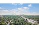 Scenic aerial view of the city skyline nestled among lush greenery and charming homes at 1418 Glencoe St, Denver, CO 80220