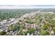 Overhead view of a residential area, showing tree-lined streets and tightly packed houses at 1418 Glencoe St, Denver, CO 80220