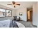 Bedroom featuring a window with natural light, carpet flooring, and neutral paint at 1418 Glencoe St, Denver, CO 80220