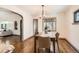 Cozy dining room with stylish furnishings, hardwood floors, and an elegant light fixture at 1418 Glencoe St, Denver, CO 80220