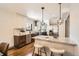 Bright kitchen with stainless steel appliances, granite countertops, stylish lighting, and hardwood flooring at 1418 Glencoe St, Denver, CO 80220