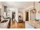 Modern kitchen features granite countertops, stainless steel appliances and beautiful hardwood flooring at 1418 Glencoe St, Denver, CO 80220