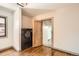 Modern laundry room features a washer and dryer set and an ornate wooden door at 1418 Glencoe St, Denver, CO 80220