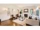 Cozy living room with fireplace, hardwood floors, and stylish decor at 1418 Glencoe St, Denver, CO 80220