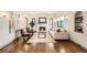Inviting living room showcasing a fireplace, hardwood floors, and ample natural light at 1418 Glencoe St, Denver, CO 80220