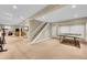 Large basement with recreation area, ping pong table, and access to other rooms at 1583 Sunset Ridge Rd, Highlands Ranch, CO 80126