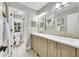Bathroom featuring double vanity and separate toilet and shower at 1583 Sunset Ridge Rd, Highlands Ranch, CO 80126