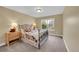 Relaxing bedroom features a metal frame bed, and bright natural light at 1583 Sunset Ridge Rd, Highlands Ranch, CO 80126