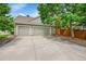 This lovely home features a two-car garage and a spacious driveway, perfect for parking and storage at 1583 Sunset Ridge Rd, Highlands Ranch, CO 80126