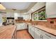 Kitchen showcasing brick backsplash, stainless steel appliances and granite counters at 1583 Sunset Ridge Rd, Highlands Ranch, CO 80126