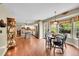 Bright and airy kitchen connected to dining area, featuring modern appliances and a charming breakfast nook at 1583 Sunset Ridge Rd, Highlands Ranch, CO 80126