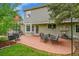 Outdoor patio space with seating area, ideal for relaxing or entertaining guests with lush greenery and fresh air at 1583 Sunset Ridge Rd, Highlands Ranch, CO 80126