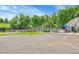 Community pool with lounge chairs and umbrellas, offering a relaxing and enjoyable outdoor experience at 1583 Sunset Ridge Rd, Highlands Ranch, CO 80126