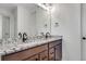 Elegant bathroom with double sinks, marble counters, and modern fixtures at 16777 W 94Th Way, Arvada, CO 80007