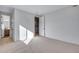 A bedroom with an ensuite bathroom and walk-in closet at 16777 W 94Th Way, Arvada, CO 80007