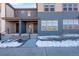 Beautiful two-story townhome with blue siding, covered entrance, and modern architectural design at 16777 W 94Th Way, Arvada, CO 80007