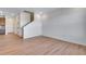 Open floor plan showing spacious living area with staircase and hardwood flooring throughout at 16777 W 94Th Way, Arvada, CO 80007