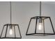 Contemporary kitchen lighting featuring pendant lights with a geometric design and stainless steel hardware at 16777 W 94Th Way, Arvada, CO 80007