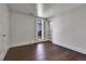 Cozy bedroom featuring hardwood floors, bright walls, and shelving providing an inviting retreat at 3131 E Alameda Ave # 1302, Denver, CO 80209