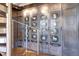 View of hallway with spiral staircase and built-in decorative wall cabinets at 3131 E Alameda Ave # 1302, Denver, CO 80209