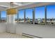 Light-filled living room with city views and decorative chandelier at 3131 E Alameda Ave # 1302, Denver, CO 80209