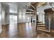 Elegant living area showcasing spiral staircase, hardwood flooring, and an open layout at 3131 E Alameda Ave # 1302, Denver, CO 80209