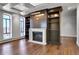 Sunlit living room featuring a fireplace and built-in shelving at 3131 E Alameda Ave # 1302, Denver, CO 80209