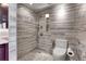 Modern shower with stylish tile design and convenient shelving for toiletries at 3131 E Alameda Ave # 1302, Denver, CO 80209