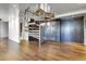 Modern spiral staircase adjacent to a closet offering a sleek design and an abundance of storage at 3131 E Alameda Ave # 1302, Denver, CO 80209