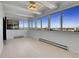 Bright sun room with large windows offering amazing city views and modern lighting at 3131 E Alameda Ave # 1302, Denver, CO 80209