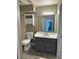 Well-lit bathroom featuring a vanity with storage, modern fixtures, and a combination tub/shower at 8645 Clay St # 400, Westminster, CO 80031
