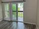 Bedroom featuring wood flooring and a sliding glass door leading to a balcony at 8645 Clay St # 400, Westminster, CO 80031