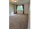 Cozy bedroom with plush carpeting, large windows, and neutral tones, creating a relaxing retreat at 8645 Clay St # 400, Westminster, CO 80031