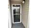 Close-up of a front glass door with white trim, showing access to a condo unit at 8645 Clay St # 400, Westminster, CO 80031