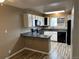 Efficient kitchen offering white cabinets, modern appliances, and countertop space for meal preparation at 8645 Clay St # 400, Westminster, CO 80031