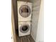 Convenient laundry area with stacked washer and dryer and built-in storage solutions for organization at 8645 Clay St # 400, Westminster, CO 80031