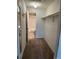 Spacious walk-in closet with ample storage and shelving, leading to a bathroom with a tub at 8645 Clay St # 400, Westminster, CO 80031