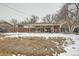 Large backyard with a covered patio provides a versatile space for relaxation and recreation at 14937 E Security Way, Aurora, CO 80011