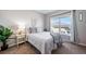 Bright bedroom featuring a window for natural lighting and stylish decor at 9431 Ashbury Cir # 103, Parker, CO 80134