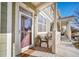 Cozy front porch with seating area, creating a welcoming entrance to the home at 9431 Ashbury Cir # 103, Parker, CO 80134