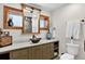 Chic bathroom with an undermount sink, modern vanity, and stylish mirror at 4241 S Meadow Brook Ln, Evergreen, CO 80439
