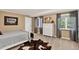Cozy bedroom with neutral colors, plush carpet, and a charming decor at 4241 S Meadow Brook Ln, Evergreen, CO 80439