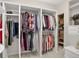 Spacious walk-in closet with custom shelving and ample storage for clothes and accessories at 4241 S Meadow Brook Ln, Evergreen, CO 80439