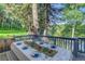Outdoor deck provides a comfortable setting for dining and enjoying nature at 4241 S Meadow Brook Ln, Evergreen, CO 80439