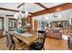 Dining area is adjacent to the kitchen and living room with views to the outside at 4241 S Meadow Brook Ln, Evergreen, CO 80439