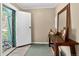 Inviting entryway with console table and mirror at 4241 S Meadow Brook Ln, Evergreen, CO 80439