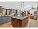 Spacious kitchen with a large island, stainless steel appliances, and custom cabinets at 4241 S Meadow Brook Ln, Evergreen, CO 80439
