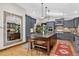 Open kitchen boasts a center island, custom cabinets, and stainless steel appliances at 4241 S Meadow Brook Ln, Evergreen, CO 80439