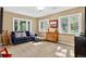 Cozy living room with natural light, comfortable sofa, and stylish decor at 4241 S Meadow Brook Ln, Evergreen, CO 80439